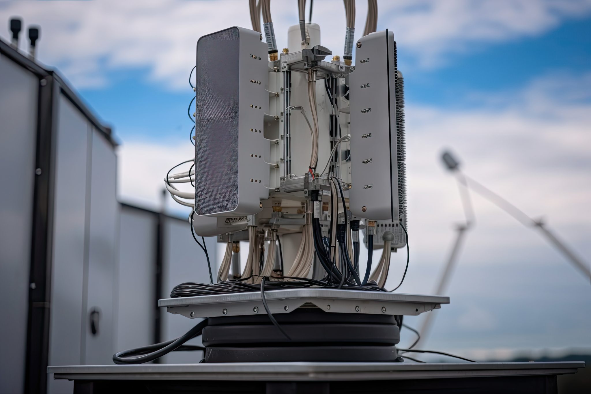 close-up of 5g antenna, with cables and equipment in the background, created with generative ai