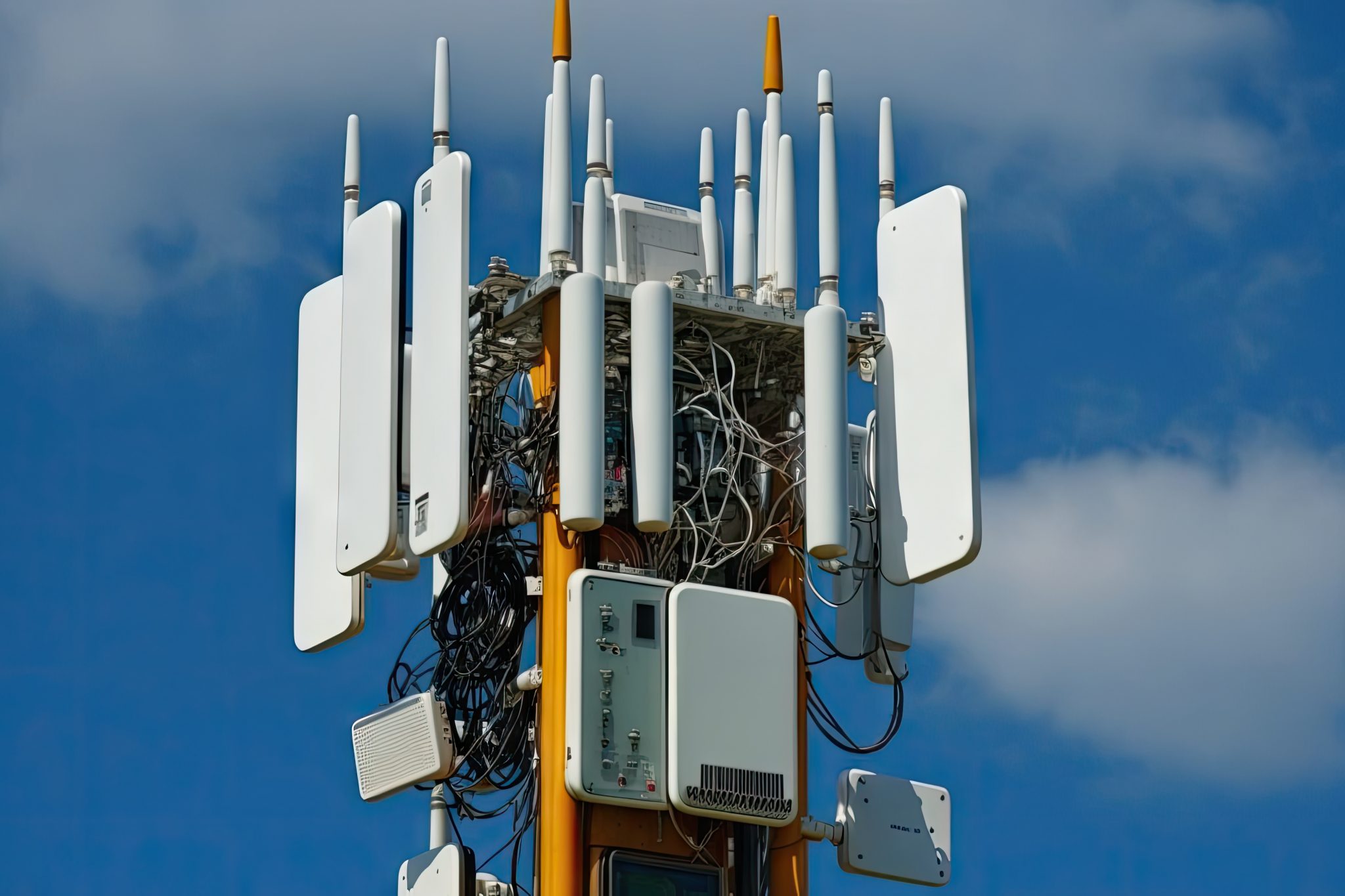 close-up of a 5g tower, with cables and antennas connecting to the network, created with generative ai