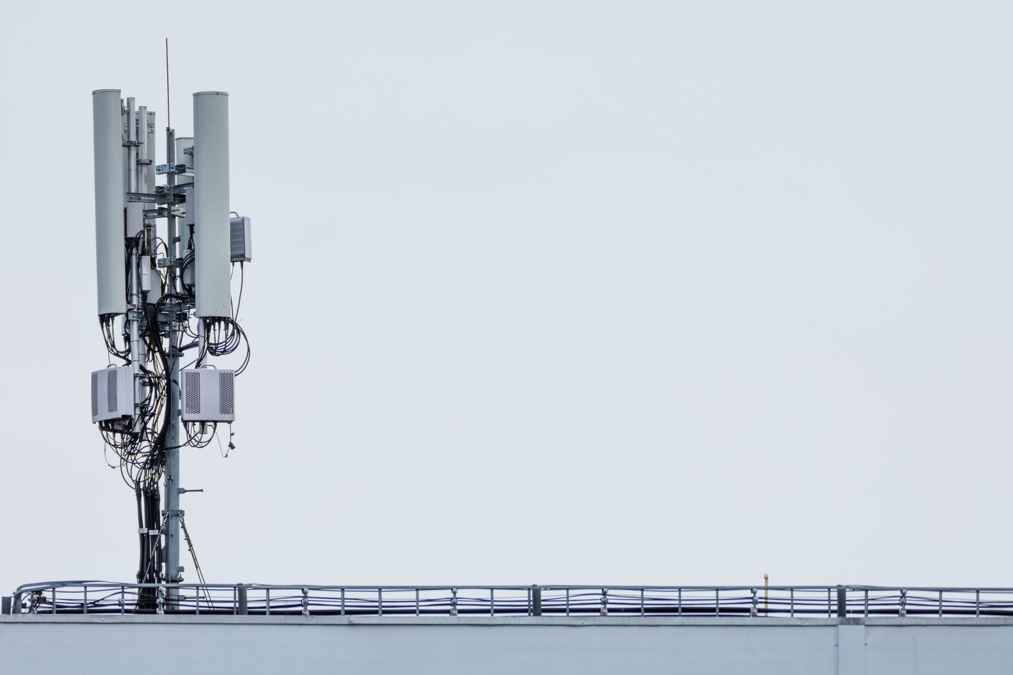 Telecommunication 5g tower for internet and mobile communication on blue sky background.